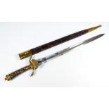 An early 19th century German hunting short sword with replaced antler grip, shell moulded guard,