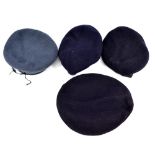 Four blue/navy cloth berets including one with broad arrows marks to interior and further stamped