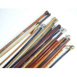 A large collection of various swagger sticks, some with military detailing to the terminals (18).