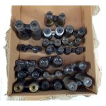 A large collection of various field glasses and horse racing binoculars.