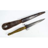 A Sykes Fairbairn type commando knife, with brass grip and shaped blade,