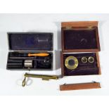 A mahogany cased travelling microscope (part missing,