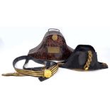 A cased Gieve Royal Navy bicorn hat with gilt anchor button and bullion work coils,
