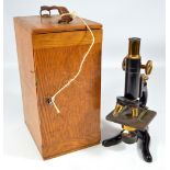 GALLENKAMP & CO LTD OF LONDON; a cased brass and lacquered 'Technico' microscope, no.