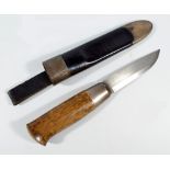A small hunting knife with wooden grip and shaped blade within a leather and 925 grade silver