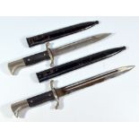 Two WWII period German fireman's dress daggers, each with checkered grips,