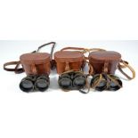 Three pairs of cased military issue binoculars for night use (3).