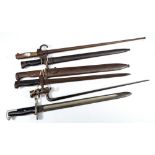 Six various bayonets including a socket bayonet, two further in scabbards,