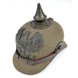 A Prussian WWI pickelhaube with metal fittings,
