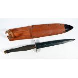A Sykes Fairbairn type commando knife, with brass grip and shaped blade,