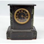 A late 19th century French black slate and green marble detailed mantel clock with circular dial