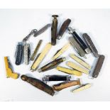 A collection of pocket and pen knives including some multi blade examples,