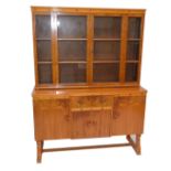 A 1940s walnut dresser with glazed upper section and cupboard and drawers to the base.