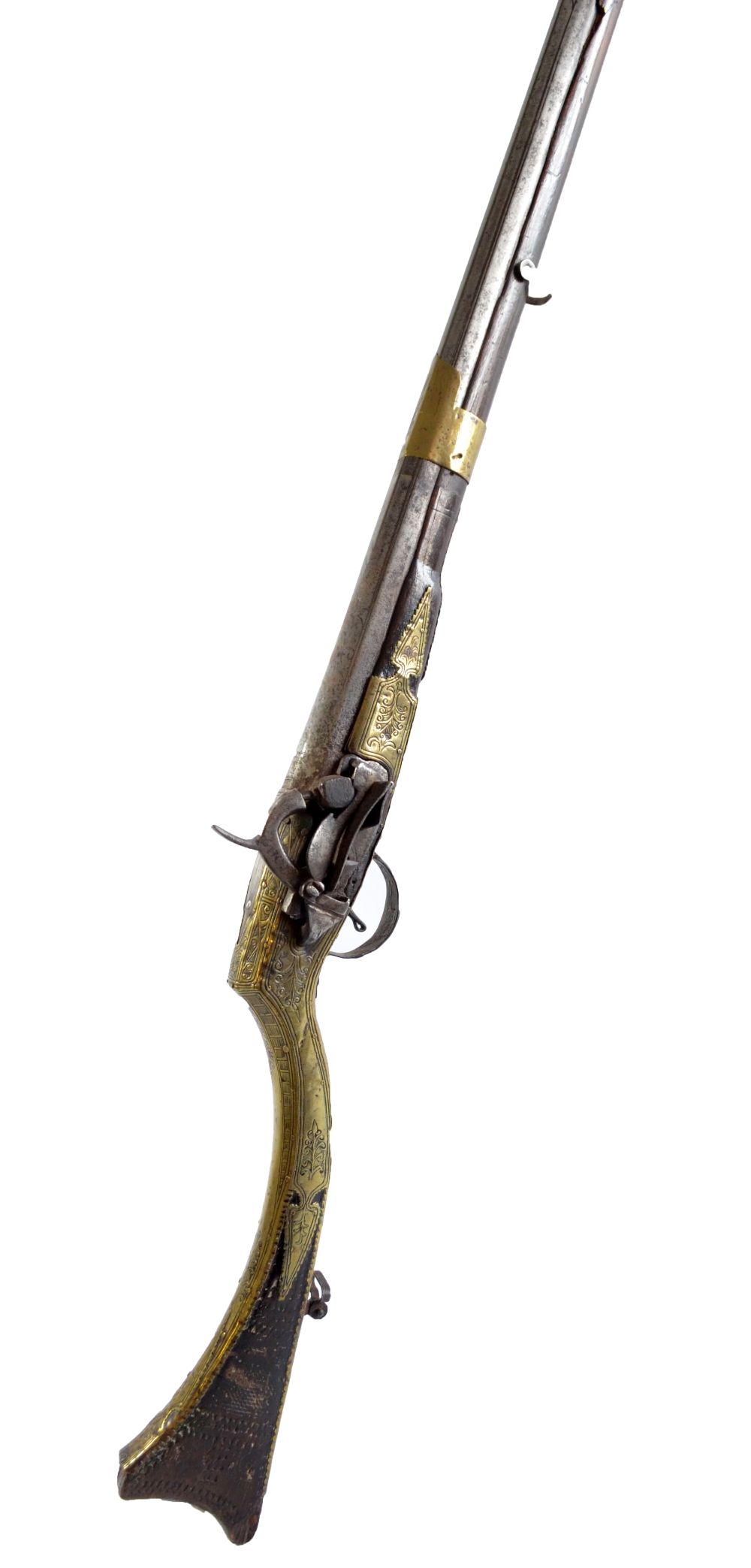 A miquelet musket converted to percussion with engraved brass detail and incised decoration to the