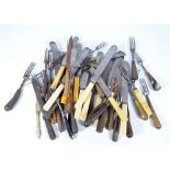 A collection of predominantly 19th century horn and antler handled knives and forks,