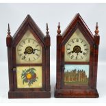 Two late 19th century American 'gingerbread' clocks each with Roman numerals to the painted dial