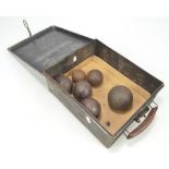 A group of six 19th century and earlier cannon balls of varied size,