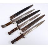 Three wooden and steel handled military issue bayonets,