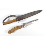 A 19th century European hunting dagger with antler handle, simple knuckle guard and shaped blade,