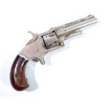 A five shot rimfire revolver, the top of the barrel stamped 'XXX Standard 1872',