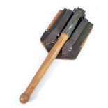 A mid-20th century wooden handled spade with green painted blade stamped '5120 12-121 1532 1964',