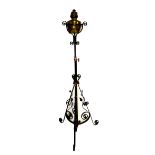 A Victorian black painted iron standard lamp with foliate and scroll detail, height approx 145cm.
