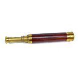 LENNIE OF EDINBURGH; a brass three-draw telescope with mahogany barrel, length 25cm.