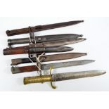 Seven various bayonets, five in scabbards, one with brass grip and with various markings (7).