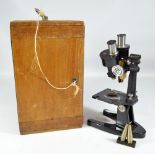 BAKER OF LONDON; a cased binocular microscope with twin platform plates,