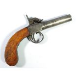 A small percussion cap pocket pistol with steel lock and walnut stock, length 17.5cm.