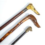 A walking stick with carved hound terminal, length 88cm,