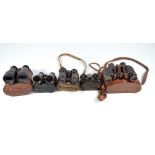 Five pairs of French binoculars including a leather cased pair inscribed to the lid 'Hunsicker &