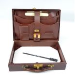 A small leather travelling case,