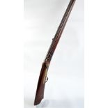 A Chinese matchlock rifle fitted with engraved octagonal barrel decorated with dragons and