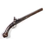 A flintlock pistol with carved decoration to the walnut stock,