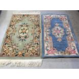 Two Chinese rugs; one green ground with floral decoration,