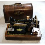 A vintage oak-cased Singer sewing machine.