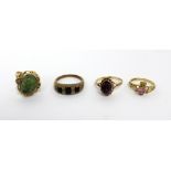 Four 9ct gold ladies' dress rings; one set with amethyst-coloured stone, size N,