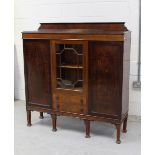 A 20th century mahogany display cabinet with astragal glazed doors,