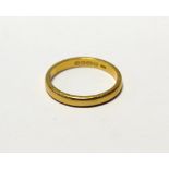 A ladies' 22ct wedding band, size O, approx 3.7g.