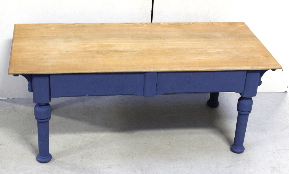 A coffee table with rectangular ash top on painted two-drawer base, 114 x 52cm.