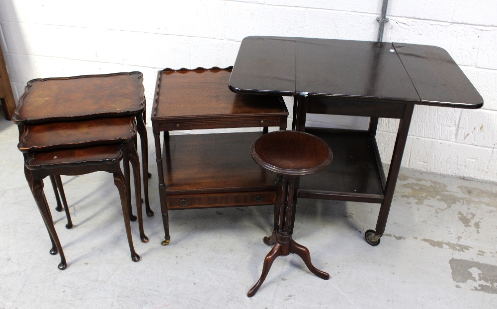 A nest of three walnut tables on cabriole supports to pad feet, a mahogany two-tier side table,