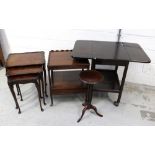 A nest of three walnut tables on cabriole supports to pad feet, a mahogany two-tier side table,