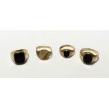 Four 9ct gold gentlemen's dress rings; three set with onyx stones and a signet ring, sizes M, N,