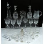 A quantity of cut glass to include two small decanters, six small spirit glasses etc.