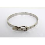 A 9ct white gold bangle with buckle clasp, 14.4g.
