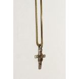 An 18ct gold link necklace with cross, approx 6.3g.