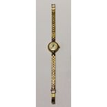 Omega; a ladies' 9ct gold wristwatch, gilded dial set with baton and Arabic numerals,