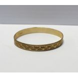 A 9ct gold bangle, approx 6.7g.
