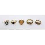 A 9ct gold gentlemen's dress ring, platform-set with three small white stones,